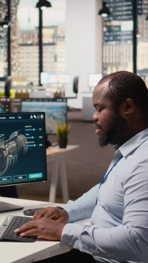 Technician using CAD software to optimize wind turbine blade aerodynamics Stock Footage 315417723