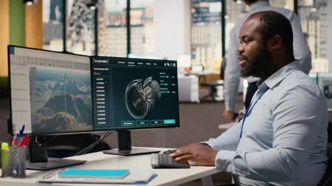 Technician using CAD software to optimize wind turbine blade aerodynamics Stock Footage 316006224