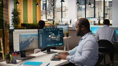 Technician using CAD software to optimize wind turbine blade aerodynamics Stock Photos