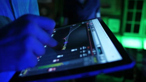 Technician using digital tablet for audio and lights control in party 4k Stock Footage 138228519
