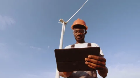 Technician using digital tablet while controlling working process of wind Stock Footage 170608266
