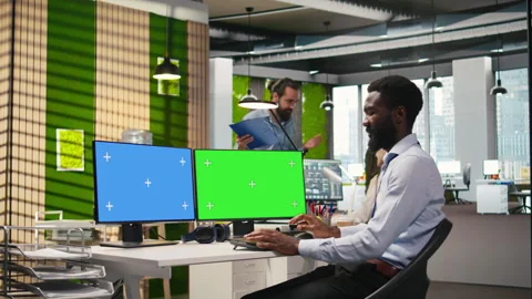 Technician using green screen PC to code AI algorithms debugging software Stock Footage 313165914