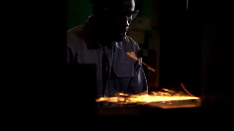 A technician is using a grinding machine to grind Stock Footage 339207012