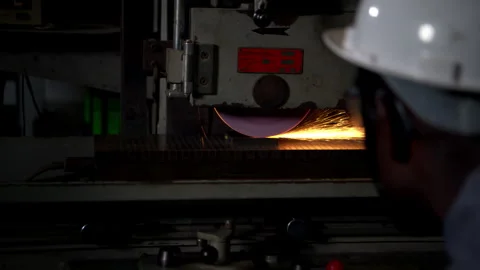 A technician is using a grinding machine to grind and shape automotive parts Stock Footage 339209223