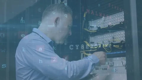 A technician is using a laptop to analyse a server in high quality format Stock Footage 328836965