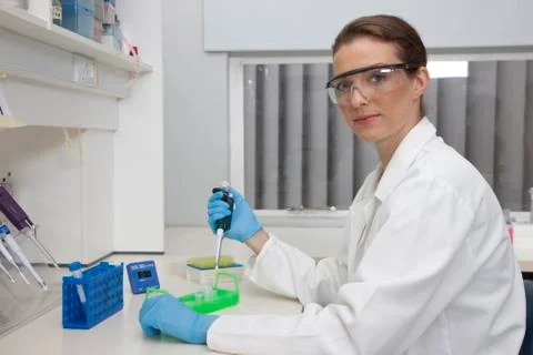 Technician using micro pipette Stock Photos