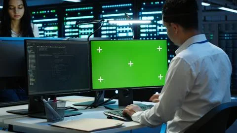 Technician using mockup computer in data center Stockfoto's