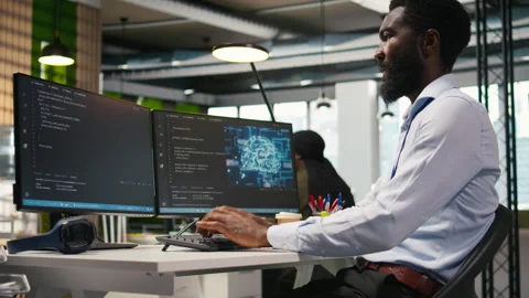 Technician using mockup laptop next to office coworkers developing applications Stock Footage 313016953