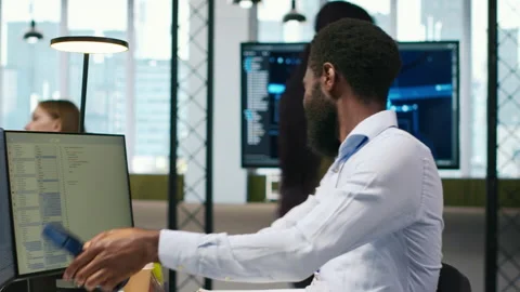 Technician using PC to code, testing applications to minimize bugs Stock Footage 313164460