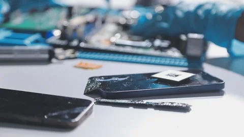 Technician using soldering iron on electronic circuit board for hardware re.. Stock Footage 345605850