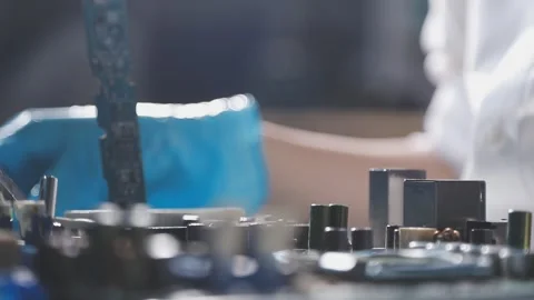 Technician using soldering iron on electronic circuit board for hardware re.. Stock Footage 345605877