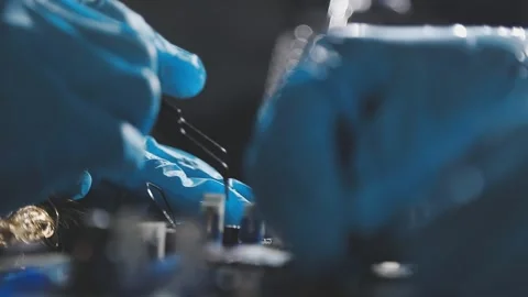 Technician using soldering iron on electronic circuit board for hardware re.. Stock Footage 345605878