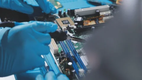 Technician using soldering iron on electronic circuit board for hardware re.. Stock Footage 345605933