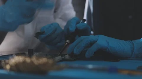 Technician using soldering iron on electronic circuit board for hardware re.. Stock Footage 345605965