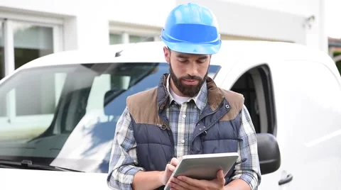 Technician using tablet and answering the phone Video stock 64761167