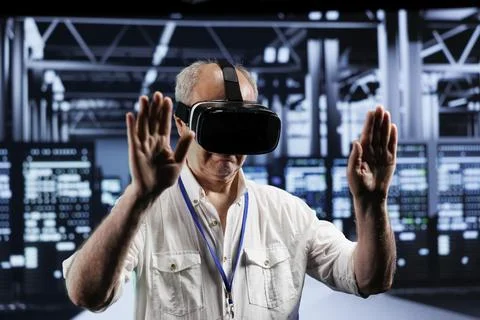 Technician using VR in data center 写真素材