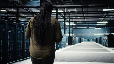 Technician walking in data center, using app on tablet to ensure error free rigs Stock Footage 317204267