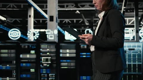 Technician walking in data center, using AR simulation to conduct security audit Stock Footage 328334624
