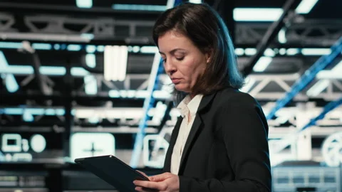 Technician walking in data center, using AR simulation to conduct security audit Stock Footage 329325436