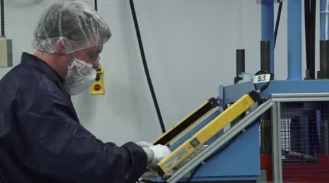 Technician walking from one machine to another in cleanroom Stock Footage 10895911