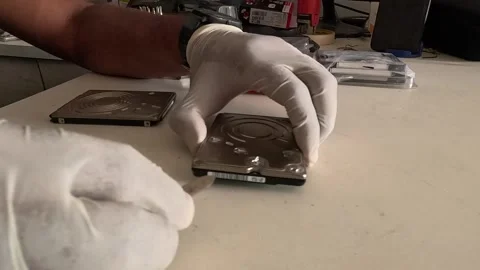 Technician wearing gloves is repairing a computer heart drive Stock Footage 247817759