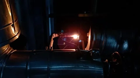 A technician is welding pipes with electrode welding Stock-Footage 329038863