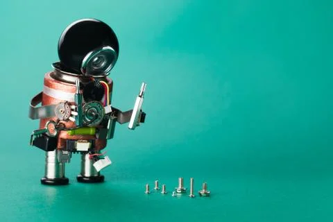 Technician worker and different size screws. Handyman robot with repair driver Stock Photos
