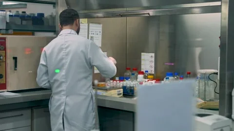 Technician Worker During The Process Of Testing Textiles For Chemicals In A Lab Stock Footage 333963885
