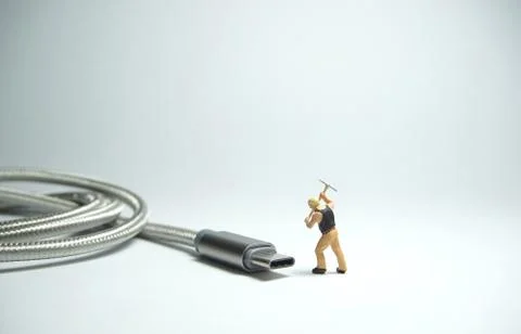 Technician worker figure standing in front of usb USB type C cable. IT suppor Stock Photos