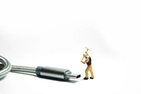 Technician worker figure standing in front of usb USB type C cable. IT suppor Stock Photos