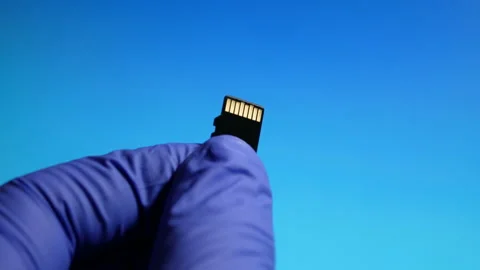 Technician worker holding in micro SD card repairing in service center. isolated Stock Footage 130814020