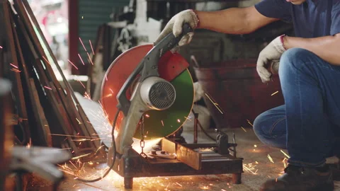 Technician worker use metal cutting machine and sparks in workshop factory Stock Footage 204055120