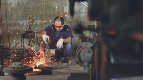 Technician worker use metal cutting machine and sparks in workshop factory Stock Footage 204055170