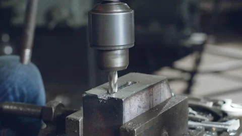 Technician worker using drilling machine for metalworking in workshop factory Stock Footage 204054869