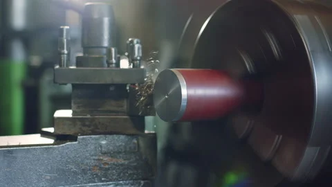 Technician worker using turning lathe machine for metalworking in factory Stock Footage 204054129