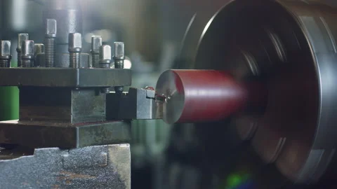Technician worker using turning lathe machine for metalworking in factory Stock Footage 204054381