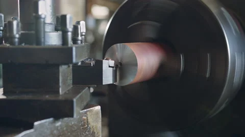 Technician worker using turning lathe machine for metalworking in factory Stock Footage 204054428