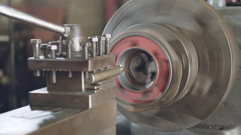 Technician worker using turning lathe machine for metalworking in factory Stock Footage 204055040
