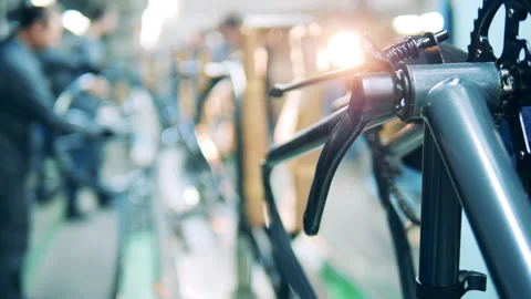 Technician is working with a bicycle chain during manufacturing Stock Footage 146638070