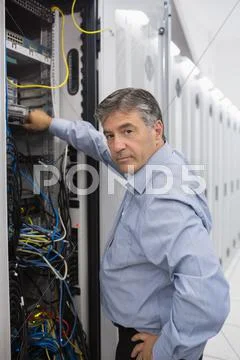 Technician working on data servers Stock Photos