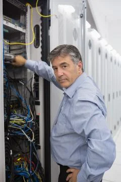 Technician working on data servers Stock Photos