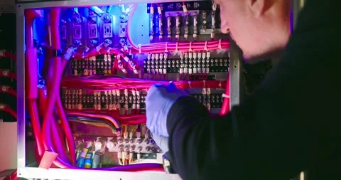 Technician Working on Electrical Panel in Engine Room Stock Footage 323746274