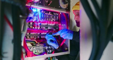 Technician Working on Electrical Panel in Engine Room Видео 323750903