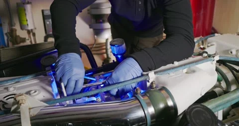 Technician Working on Engine in Industrial Setting Видео 323740205