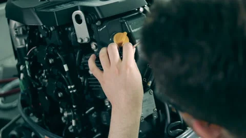 Technician is working with an engine of a sailboat Video stock 138081923