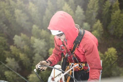 Technician Working at Height on a 5g Telecom Tower 写真素材