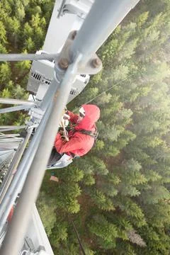 Technician Working at Height on a 5g Telecom Tower 写真素材
