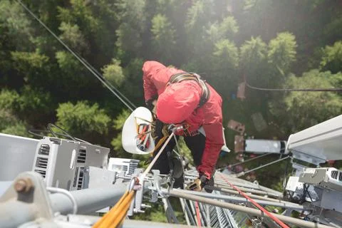 Technician Working at Height on a 5g Telecom Tower Foto stock