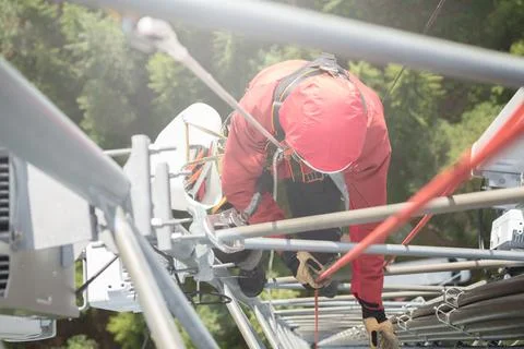 Technician Working at Height on a 5g Telecom Tower 写真素材