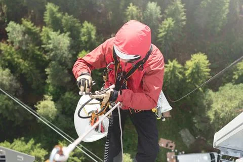 Technician Working at Height on a 5g Telecom Tower 写真素材
